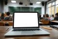 Laptop with White Screen on College Lecture Hall Desk Royalty Free Stock Photo