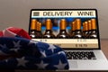 laptop with wine delivery and usa flag Royalty Free Stock Photo