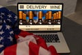 laptop with wine delivery and usa flag Royalty Free Stock Photo