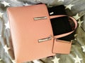 Allways online. Laptop in womens pink leather handbag
