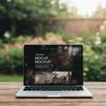 A laptop on a wooden table displays a website mockup with text and images.
