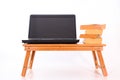 Laptop on a wooden table & old books Royalty Free Stock Photo