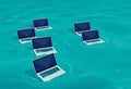 Laptops Adrift in Turquoise Waters