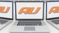 Laptops with au mobile phone company logo on the screen. Computer technology conceptual editorial 3D rendering
