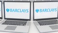 Laptops with Barclays logo on the screen. Computer technology conceptual editorial 4K clip, seamless loop