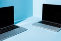 Laptops with blank screens on blue Royalty Free Stock Photo