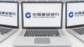 Laptops with China Construction Bank logo on the screen. Computer technology conceptual editorial 3D rendering