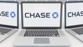 Laptops with JPMorgan Chase Bank logo on the screen. Computer technology conceptual editorial 3D rendering Royalty Free Stock Photo