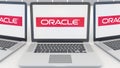 Laptops with Oracle Corporation logo on the screen. Computer technology conceptual editorial 3D rendering