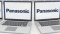 Laptops with Panasonic Corporation logo on the screen. Computer technology conceptual editorial 4K clip, seamless loop