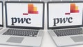 Laptops with PricewaterhouseCoopers PwC logo on the screen. Computer technology conceptual editorial 4K clip, seamless