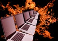 Laptops row in fiery ring Royalty Free Stock Photo