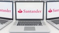 Laptops with Santander Serfin logo on the screen. Computer technology conceptual editorial 3D rendering