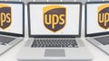 Laptops with United Parcel Service UPS logo on the screen. Computer technology conceptual editorial 3D rendering