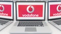 Laptops with Vodafone logo on the screen. Computer technology conceptual editorial 3D rendering