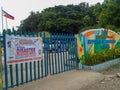 A huge tarpaulin and the Philippine flag is in front of a public school