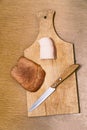 Lard, knife and rye bread on cutting board Royalty Free Stock Photo