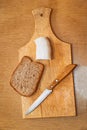 Lard, knife and rye bread on cutting board Royalty Free Stock Photo