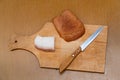 Lard, knife and rye bread on cutting board Royalty Free Stock Photo