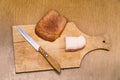 Lard, knife and rye bread on cutting board Royalty Free Stock Photo