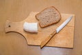 Lard, knife and rye bread on cutting board Royalty Free Stock Photo