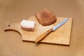 Lard, knife and rye bread on cutting board Royalty Free Stock Photo