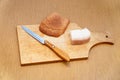 Lard, knife and rye bread on cutting board Royalty Free Stock Photo