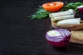 Lard salo with bread with red onions on the background of the tomato with garlic, dill on wooden table Royalty Free Stock Photo