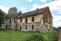 Large abandoned brick house with glassless windows