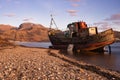 Large abandoned shipwreck on the shore of Loch Linnhe in Scotland at sunset Royalty Free Stock Photo