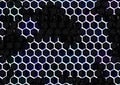 Large image of hexagonal pattern with white divisions and cool-colored cells on dark metallic surface.