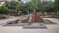 Large abstract steel fountain on the campus of the University of Texas at Arlington.