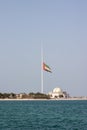 Large Abu Dhabi flag flying at half-mast