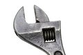 Large adjustable wrench on a white background. Insulated object. Old worn tool for mechanic. Metal texture close-up