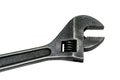 Large adjustable wrench on a white background. Insulated object. Old worn tool for mechanic. Metal texture close-up