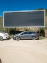 large advertising panel with nothing, just a black image, installed in a public car park in the town of Sesimbra