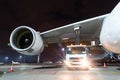 Large aircraft jet engines, Fueling a huge airplane, a truck with fuel with hoses connected to a fuel tank. Royalty Free Stock Photo