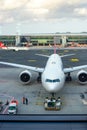 A large aircraft of a Turkish airline in the passenger boarding area, view from the airport building. Turkey, Istanbul