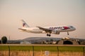 Large airliner just before landing in the evening at sunset. Royalty Free Stock Photo