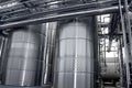 Large aluminum drums tanks and pipelines modern plant for the pr Royalty Free Stock Photo