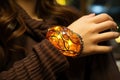 A large amber stone decorated with silver on the girl& x27;s hand. Royalty Free Stock Photo