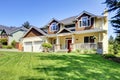 Large American beautiful house with red door.