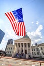 St Louis, Missouri, United States-circa 2014-Large American Flag Flying in the Wind in Front of the Old Courthouse Downtown Royalty Free Stock Photo