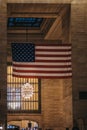 Large American flag inside Grand Central Terminal, New York, USA.