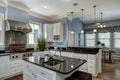 Large American style kitchen and dining room interior with granite countertops