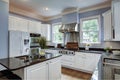 Large American style kitchen interior with granite countertops