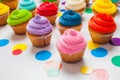 Large amount of birthday muffins with colorful butter cream Royalty Free Stock Photo