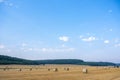 large amount of straw bales in golden landscape of lorraine under blue summer sky Royalty Free Stock Photo