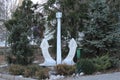 Large anchor standing near trees. It is a monument to shipbuilding.