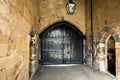 Large ancient black wooden doors in the Tower of London
